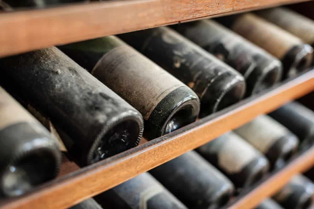 Old wine stored on a cellar shelf